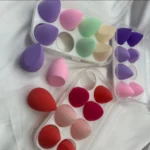 set of multi-colored, mini beauty makeup sponges in a plastic case